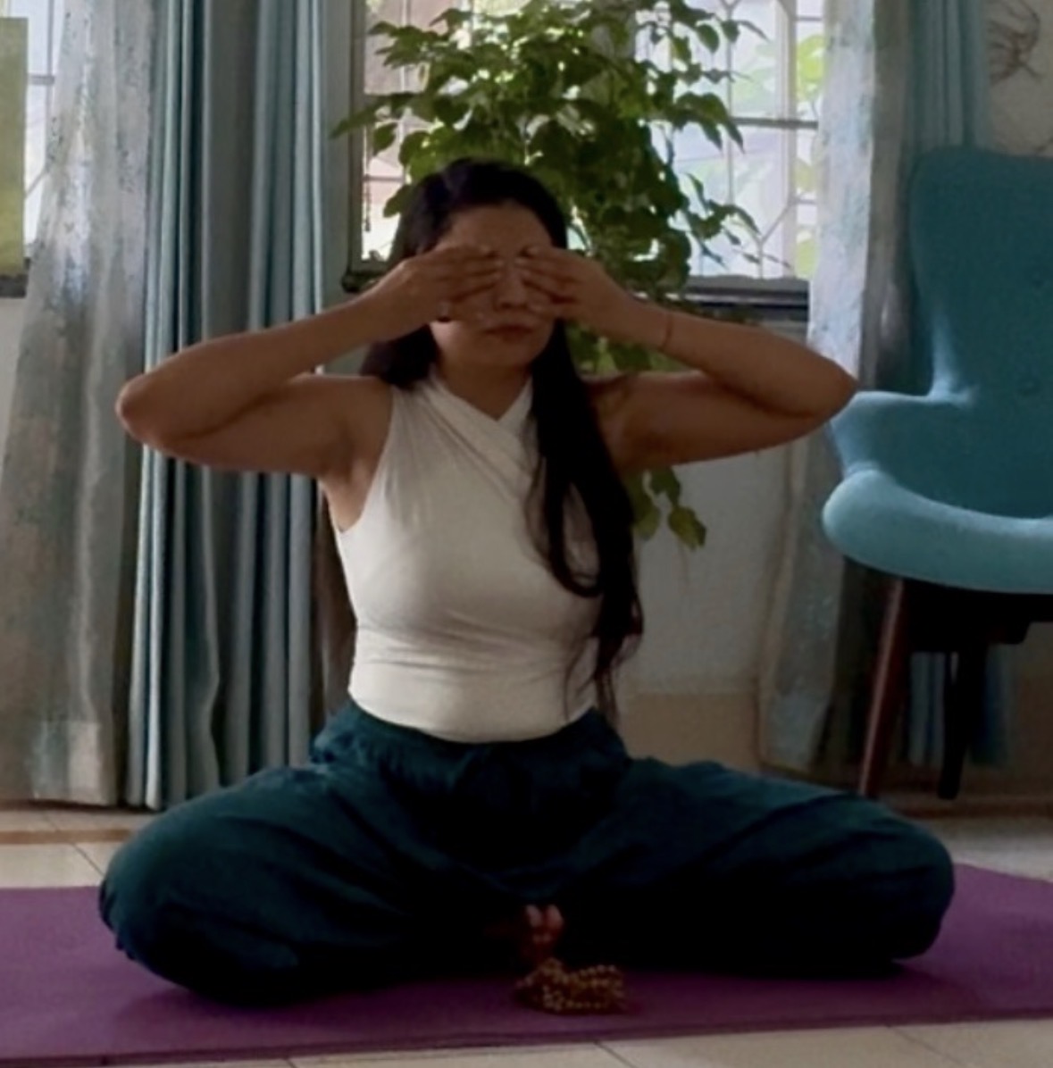 Major Smita Verma demonstrating a seated yogic practice
